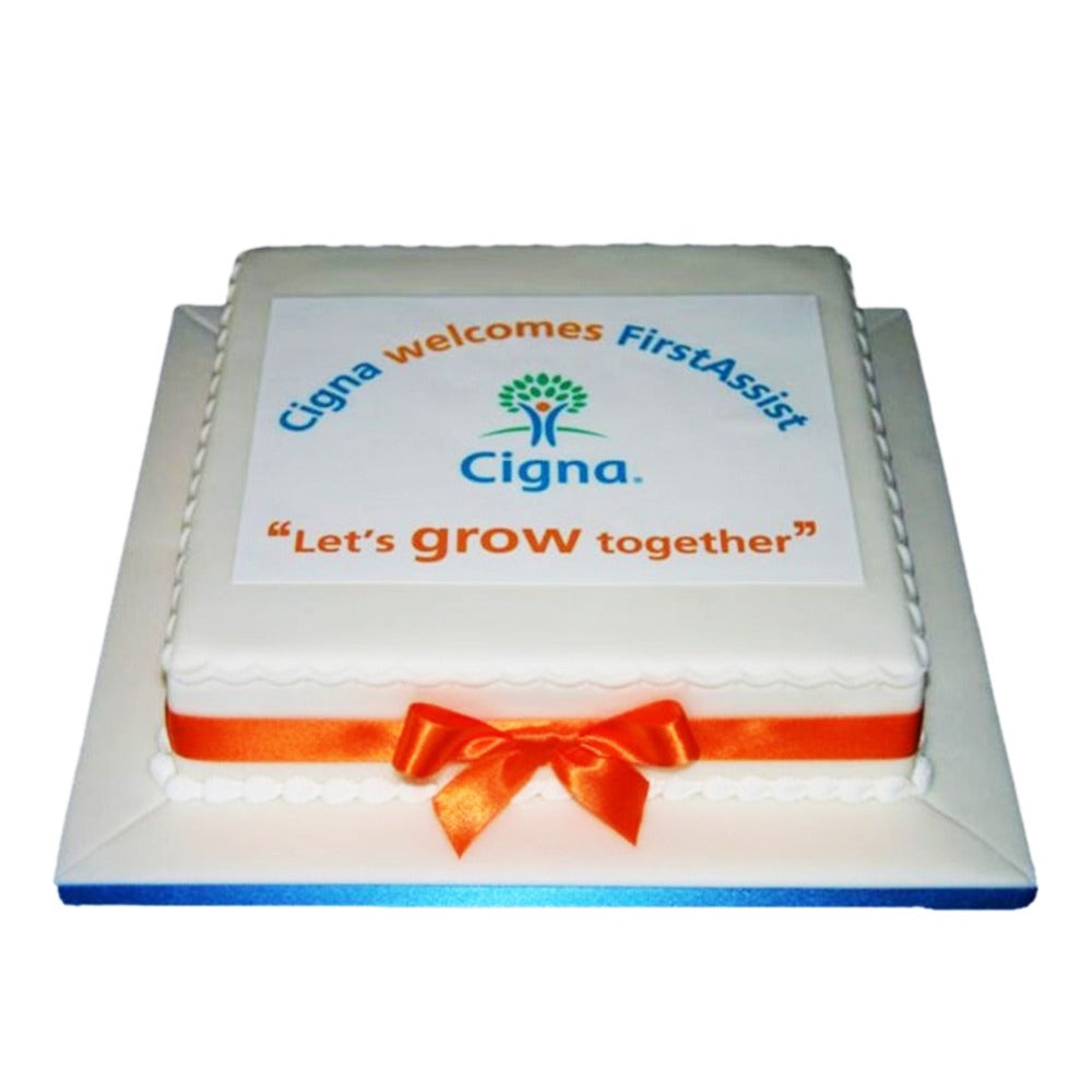 “Corporate celebration cake with flickering candles for team gathering”