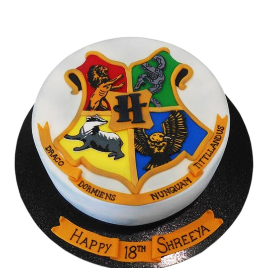 Harry Potter birthday cake with Hogwarts house crest 

