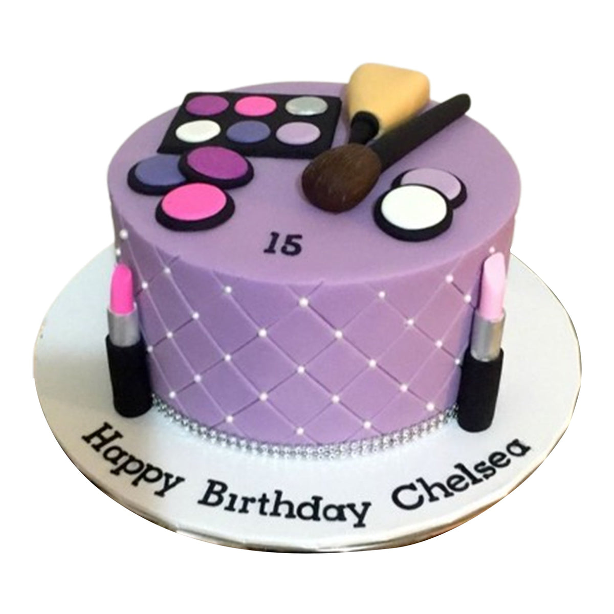 Handcrafted fondant lipstick tubes with intricate edible details, perfect for a makeup-lover's dream cake.
