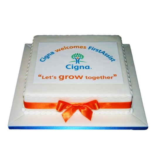 “Corporate celebration cake with flickering candles for team gathering”